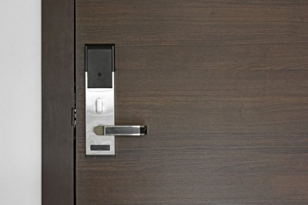 hotel electronic card lock on wooden door